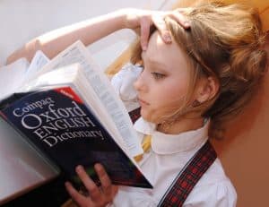 Young woman with a dictionary